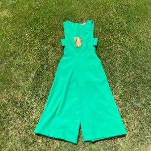 Green jumpsuit with open cleavage